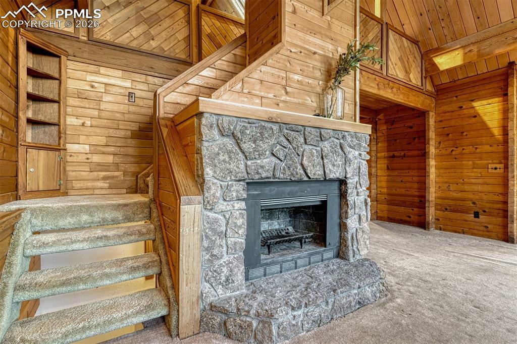 Great room moss rock fireplace is gas or wood