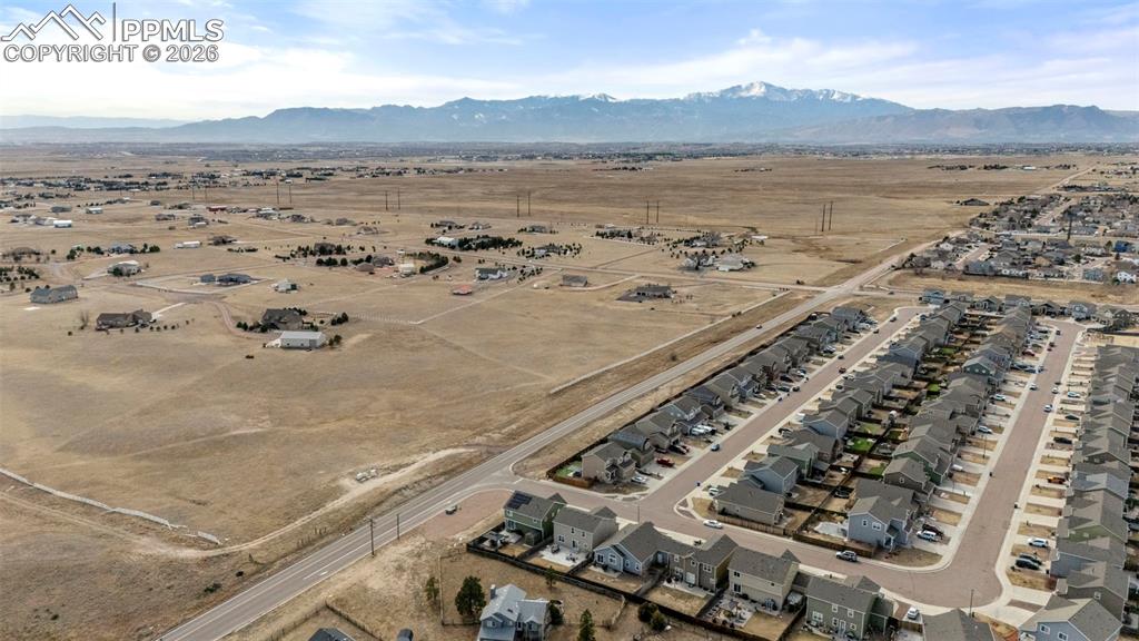 Overview of rural landscape featuring a desert landscape and nearby suburban area