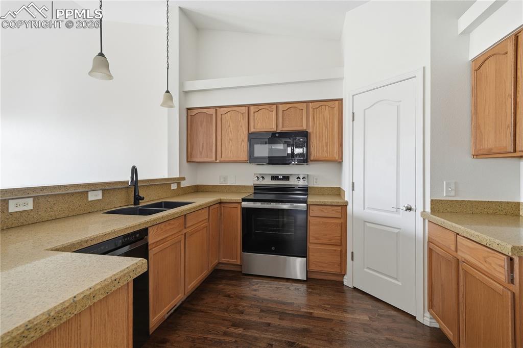 Kitchen with newer appliances and updated counters