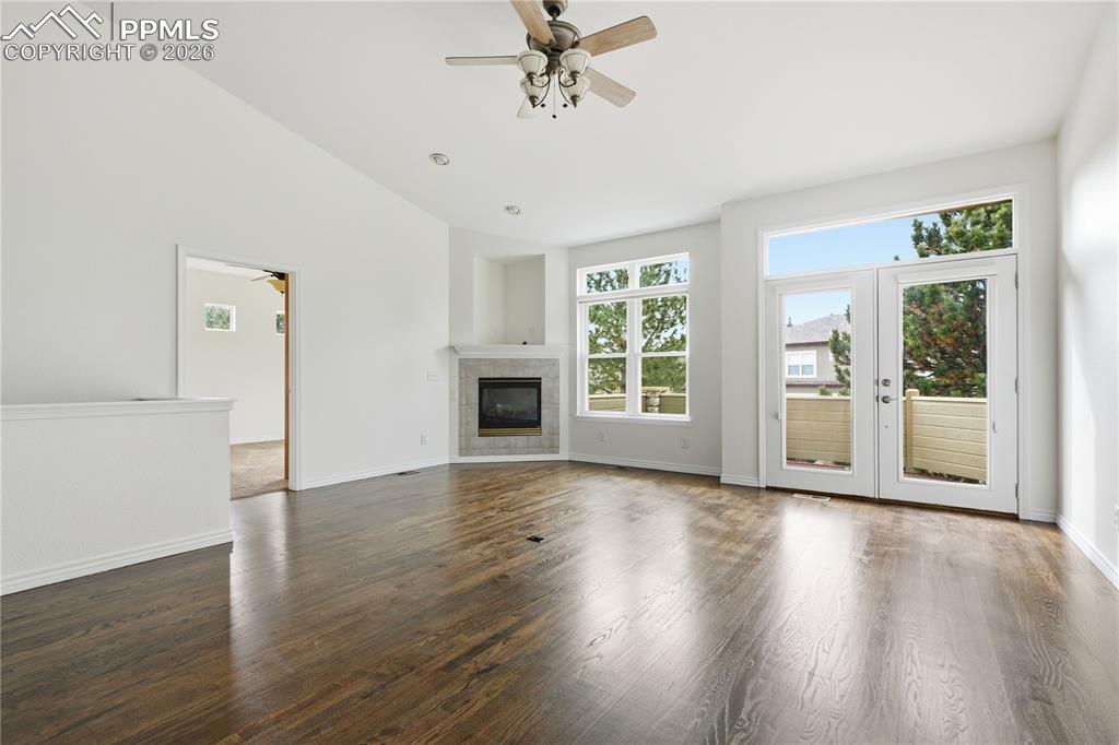Family room features newly refinished hardwood floors and fresh paint