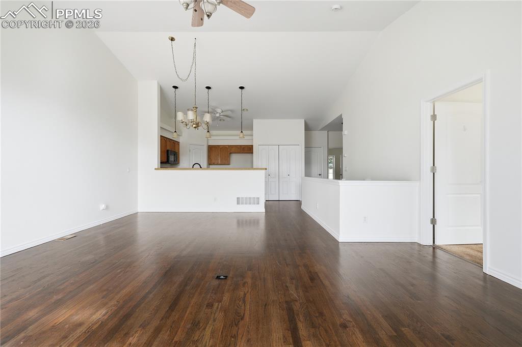 Open floor plan features newly refinished hardwood floors and fresh paint