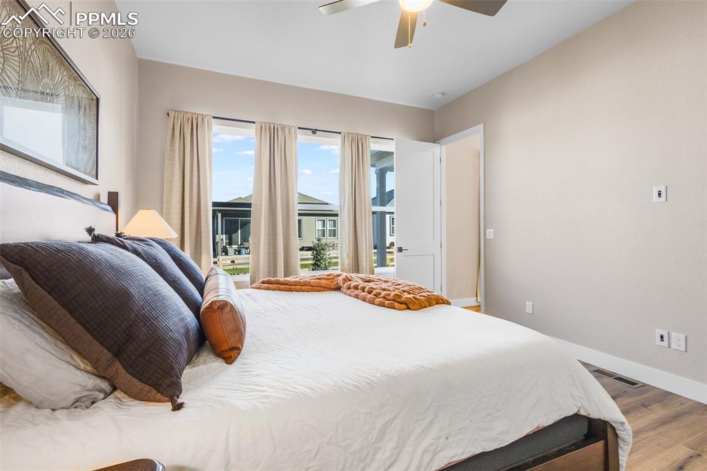 main level primary bedroom with walk in closet and ensuite bathroom