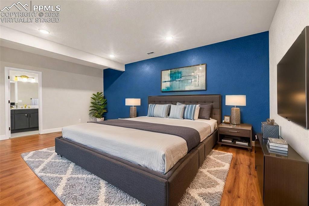 huge lower level bedroom w/ ensuite full bathroom - virtually staged