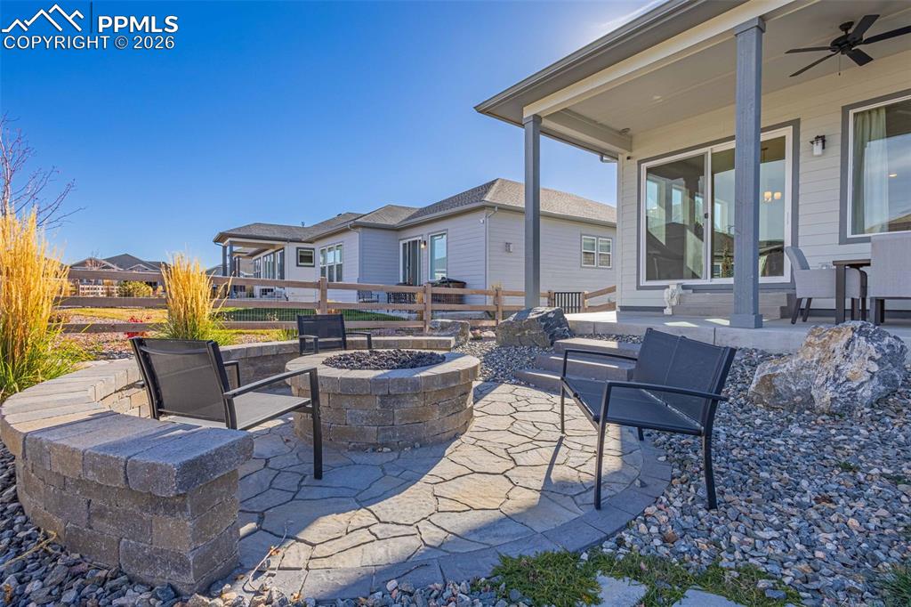 View of patio / terrace featuring a fire pit and ceiling fan