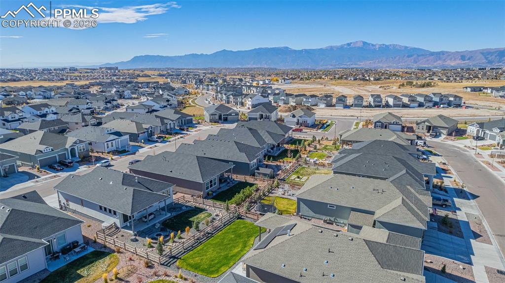 Aerial perspective of suburban area featuring a mountainous background