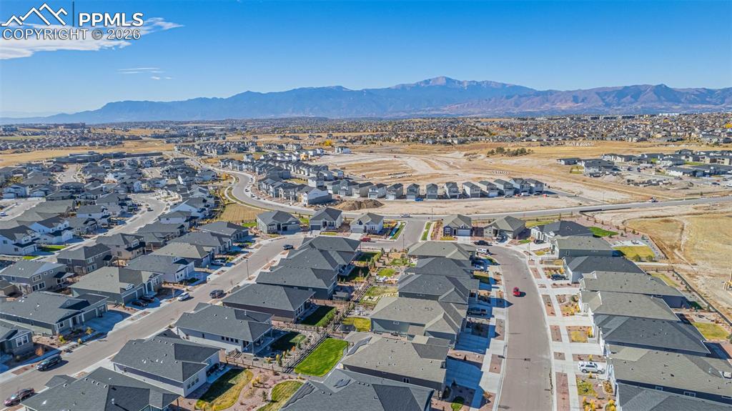 Aerial perspective of suburban area with a mountain backdrop