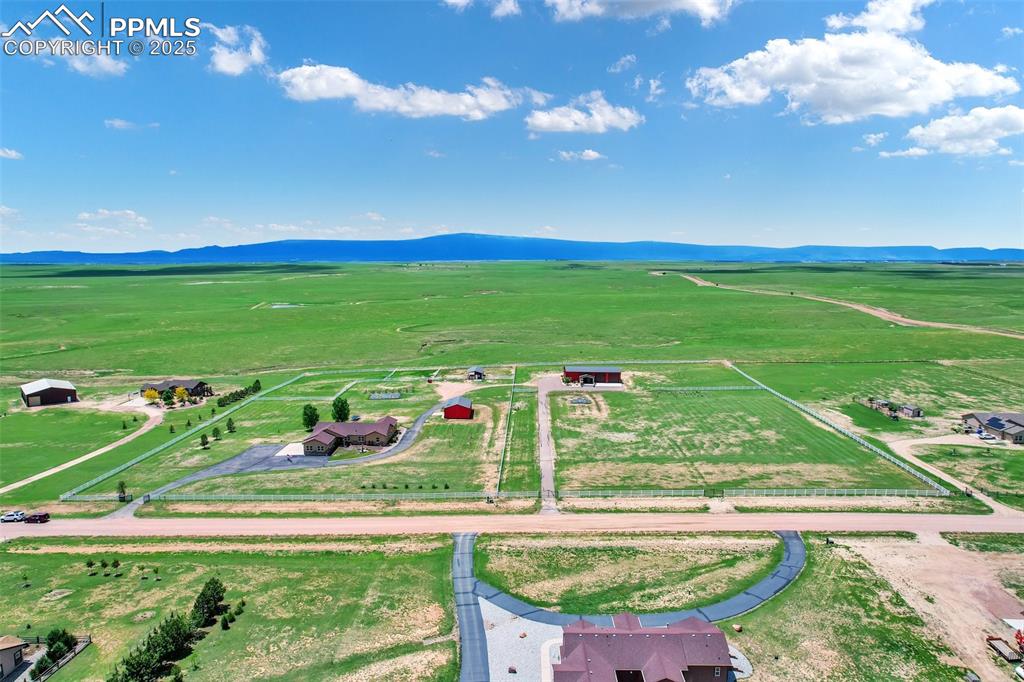Drone / aerial view featuring a mountain view and a rural view