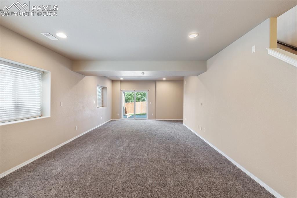Basement - Family Room with walk-Out - Spare room featuring recessed lighting and carpet floors
