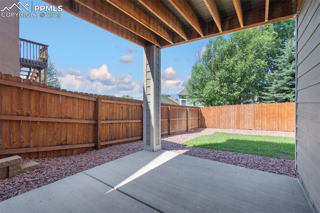Fenced backyard with a patio area