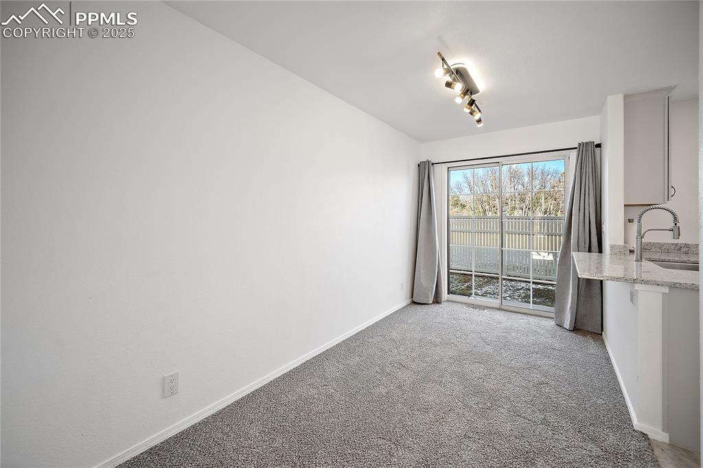 Dining room open to kitchen and walks out to back patio. 