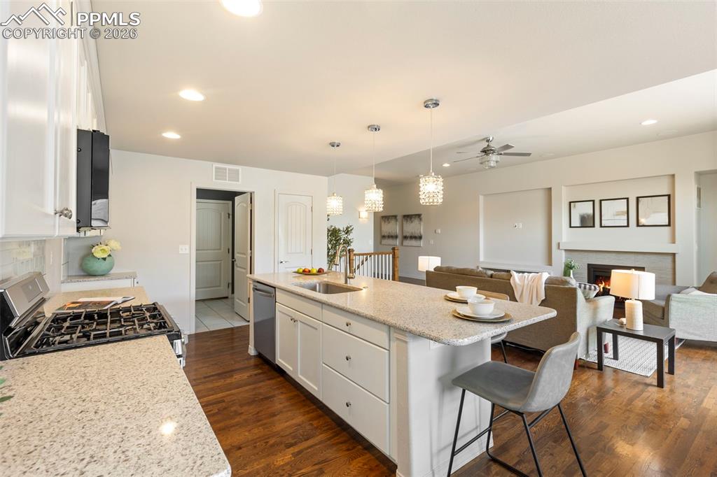 Dining area with modern pendant lighting overlooking the backyard.