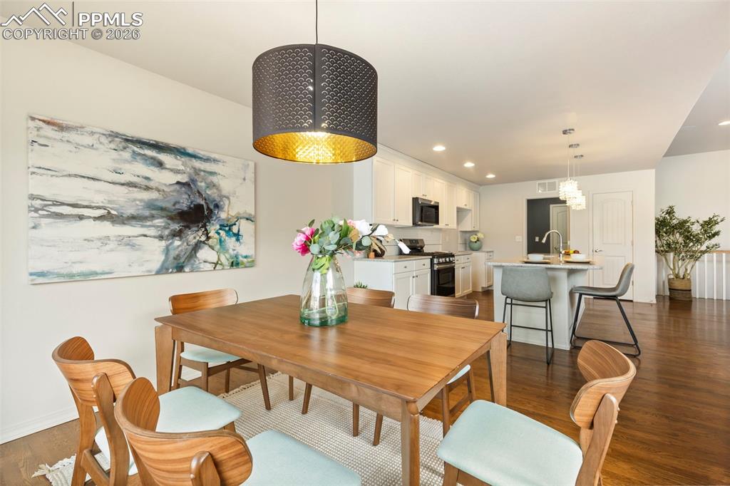 Alternate view of the primary suite with view of backyard