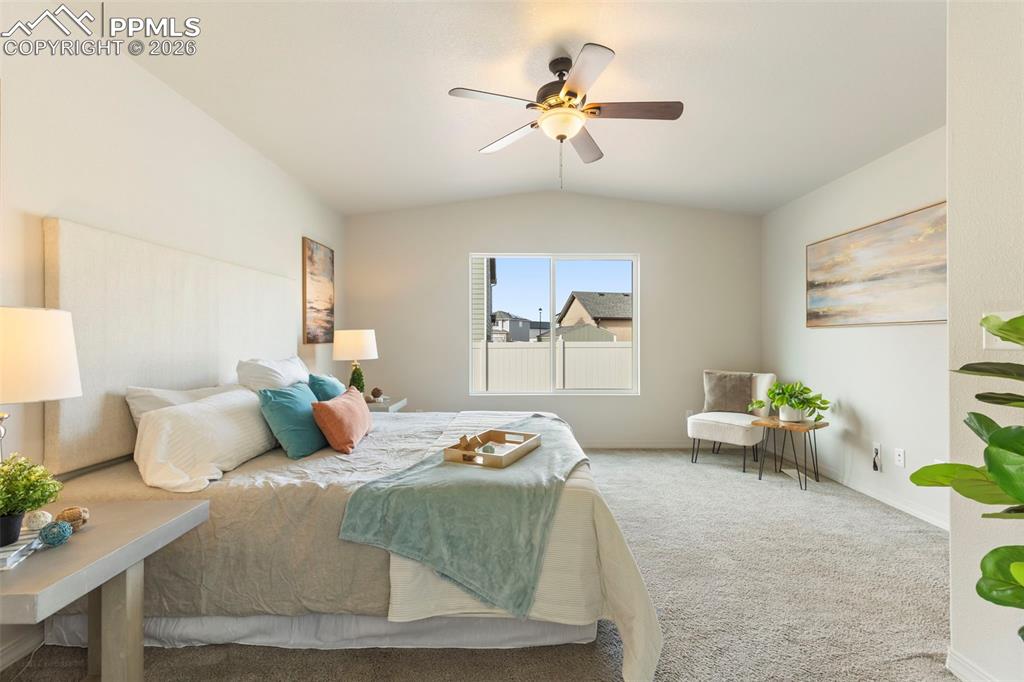 Custom double walk-in closet featuring built-in drawers, shelving, and hanging space.