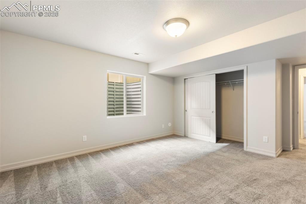 Virtually Staged Lower Level Bedroom
