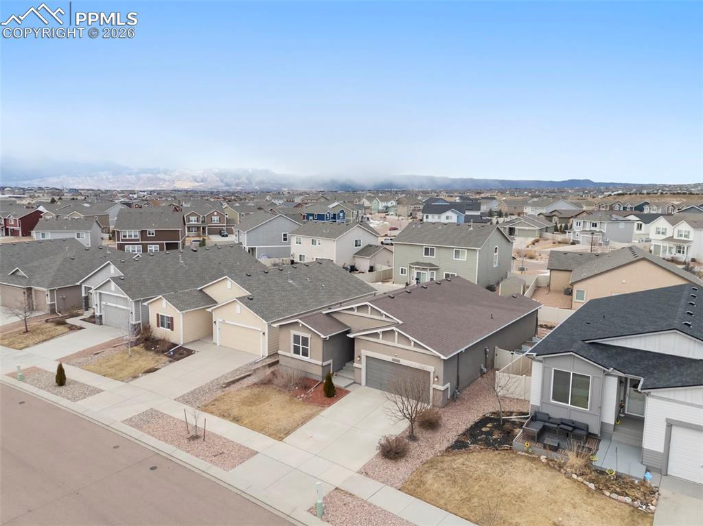 Additional finished basement bedroom or flex space with neutral finishes and natural light.