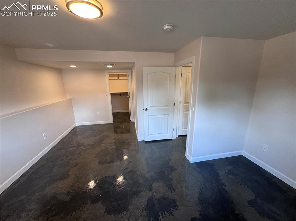 Empty room featuring baseboards