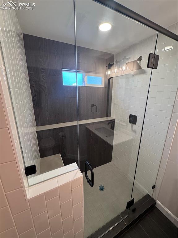 Full bath featuring a stall shower