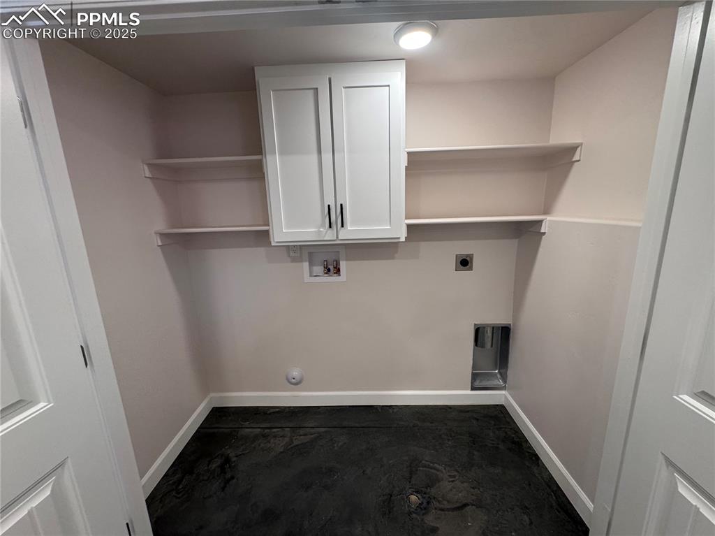 Laundry area featuring cabinet space, hookup for a washing machine, and electric dryer hookup
