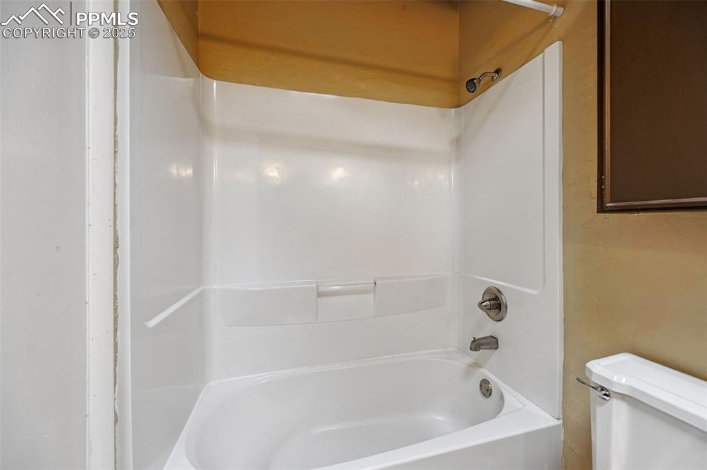 Bathroom with toilet and shower / tub combination