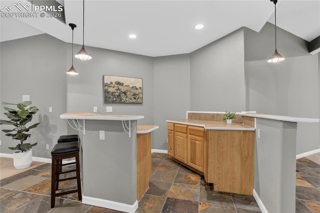 Dry bar with barstool seating