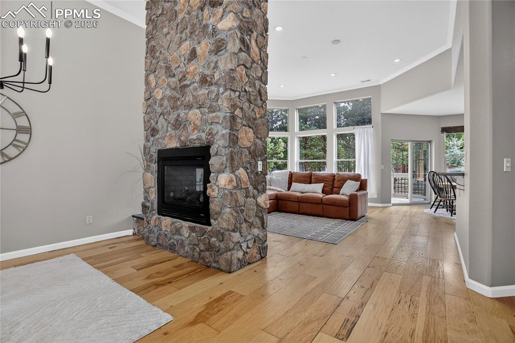 Open entertainment space w/ stacked stone fireplace