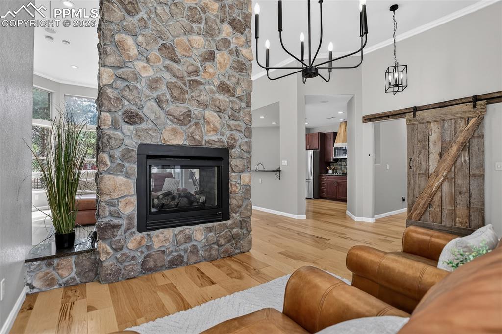 Double sided fireplace shared by living room & family room