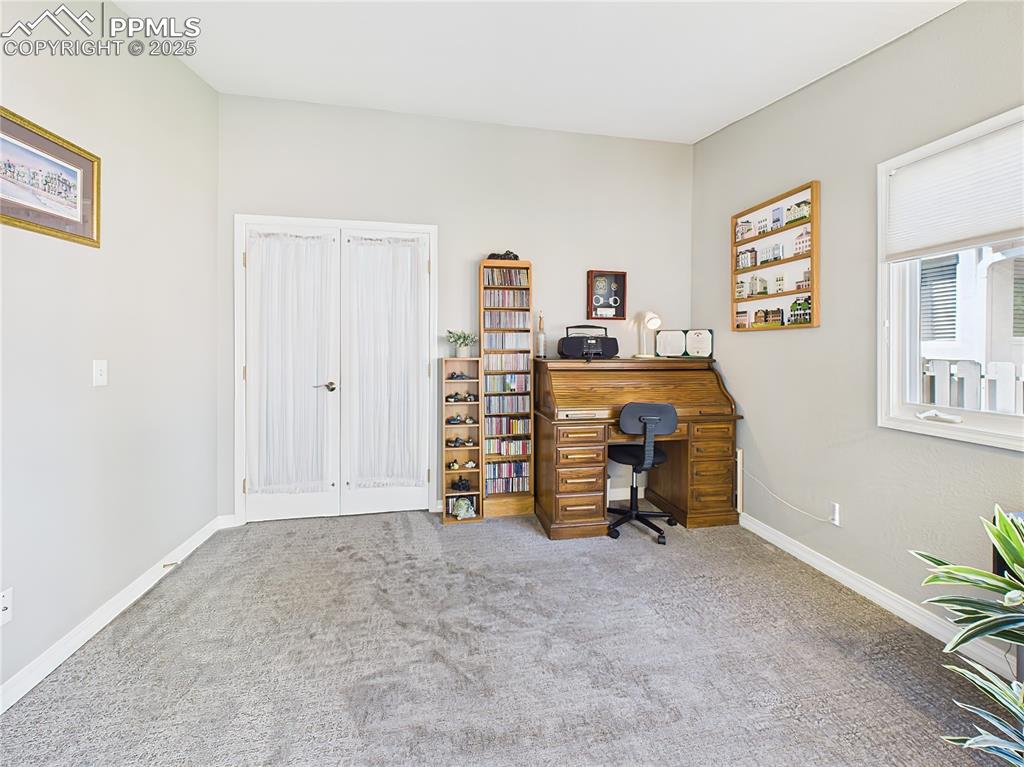 Home Office – Bright and versatile bonus room with neutral tones and plush carpet—ideal for a home office, craft room, or library.