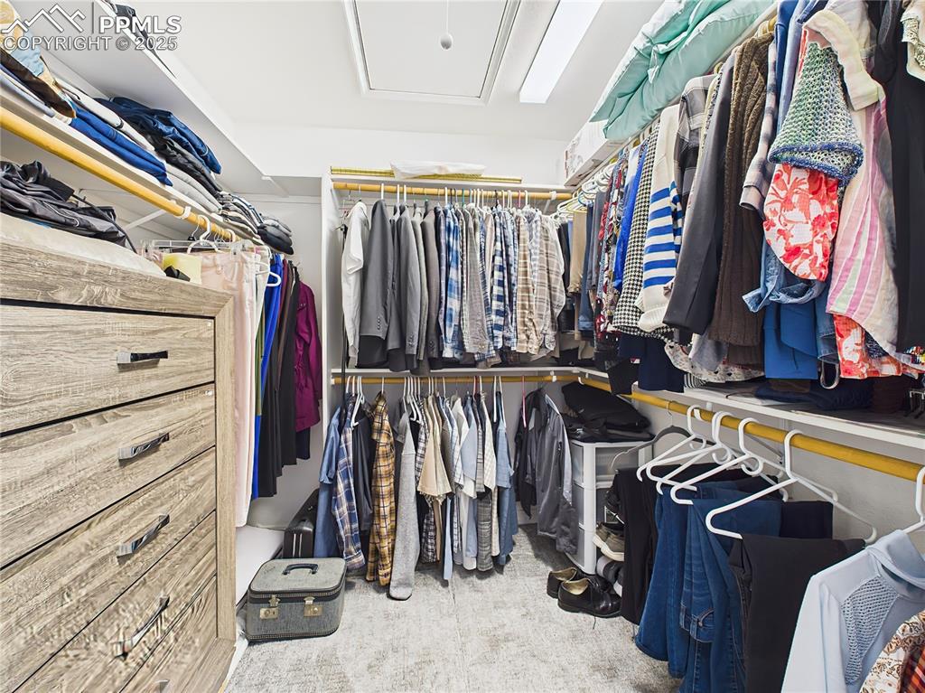 Walk-In Closet – Expansive walk-in closet with built-in shelving, hanging space, and room for a dresser—ideal for organized storage.