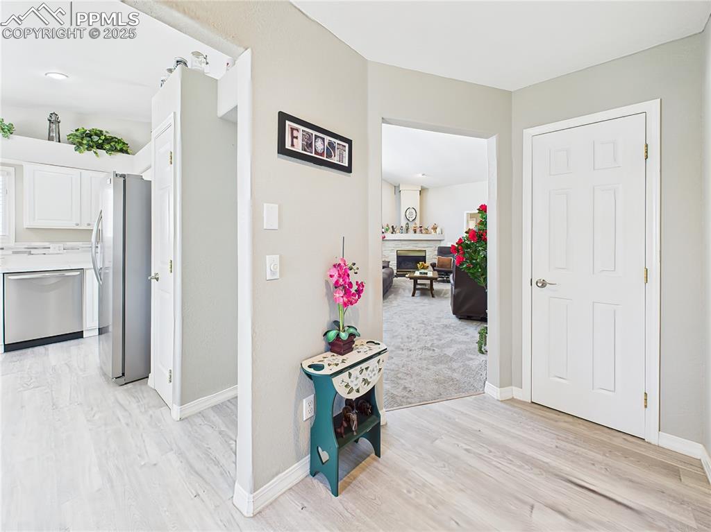 Entry Foyer entry hallway provides easy access to both the kitchen and living spaces, with fresh paint and clean sightlines.