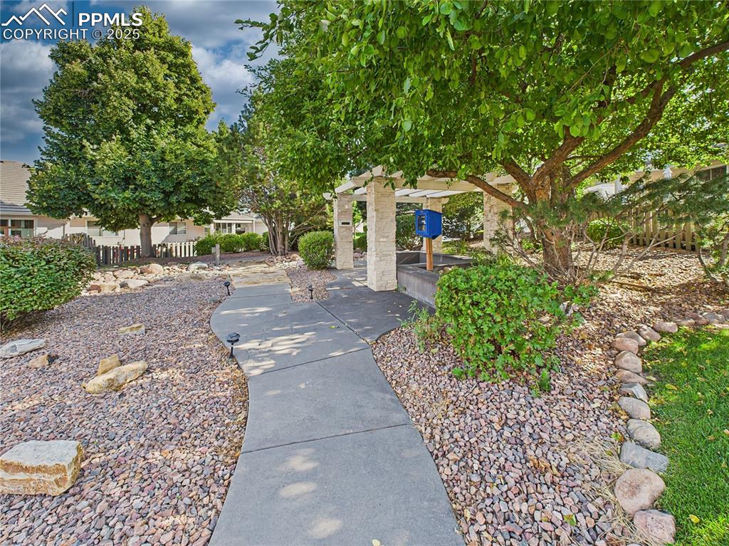 Community Pavilion off Guest Parking – Tree-lined walkway leads to the pavilion, creating a peaceful, park-like community feature.