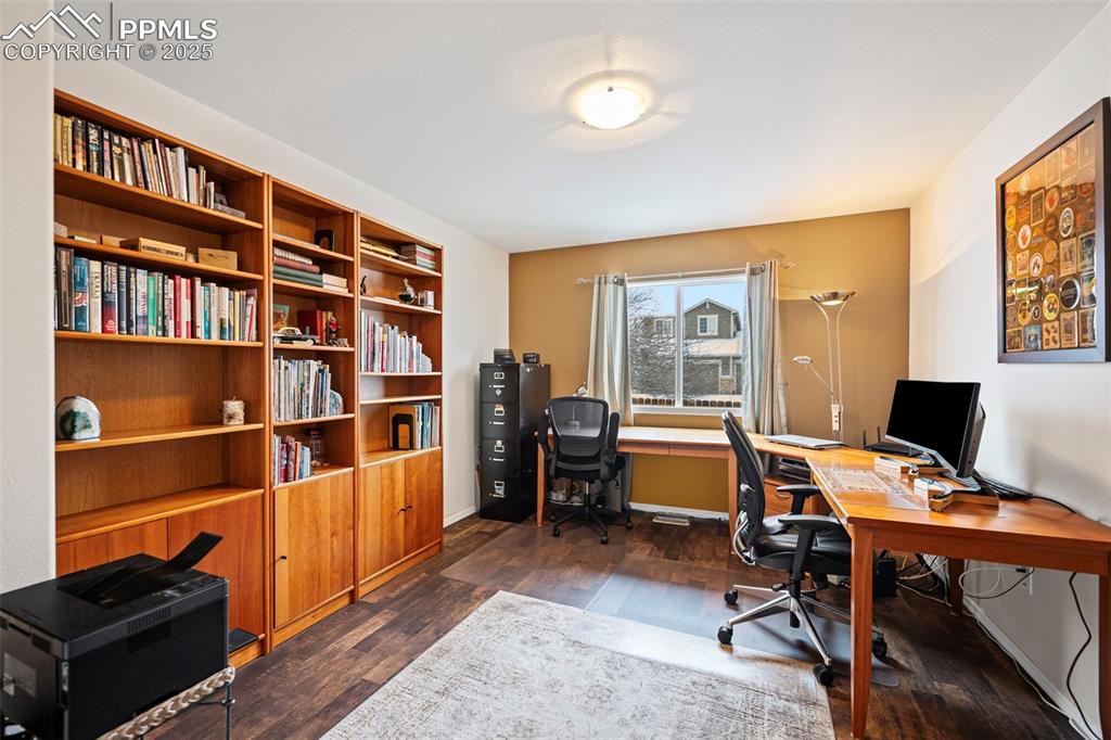 Office with built in bookshelves that can also be used as a third bedroom