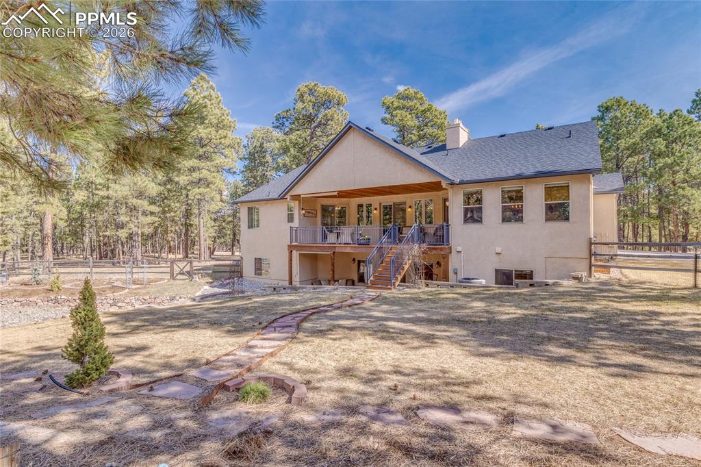 Beautifully landscaped fenced backyard.