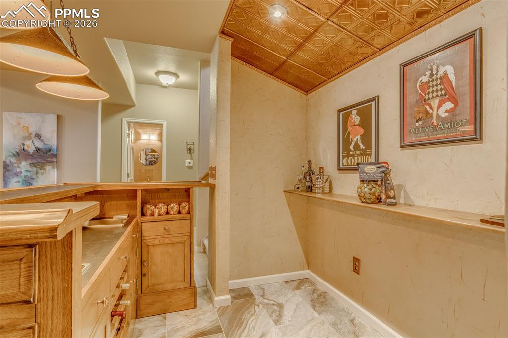Great dry bar with wood ceiling.