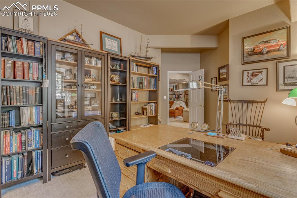 This bonus room located in the basement is currently being used as a second office.