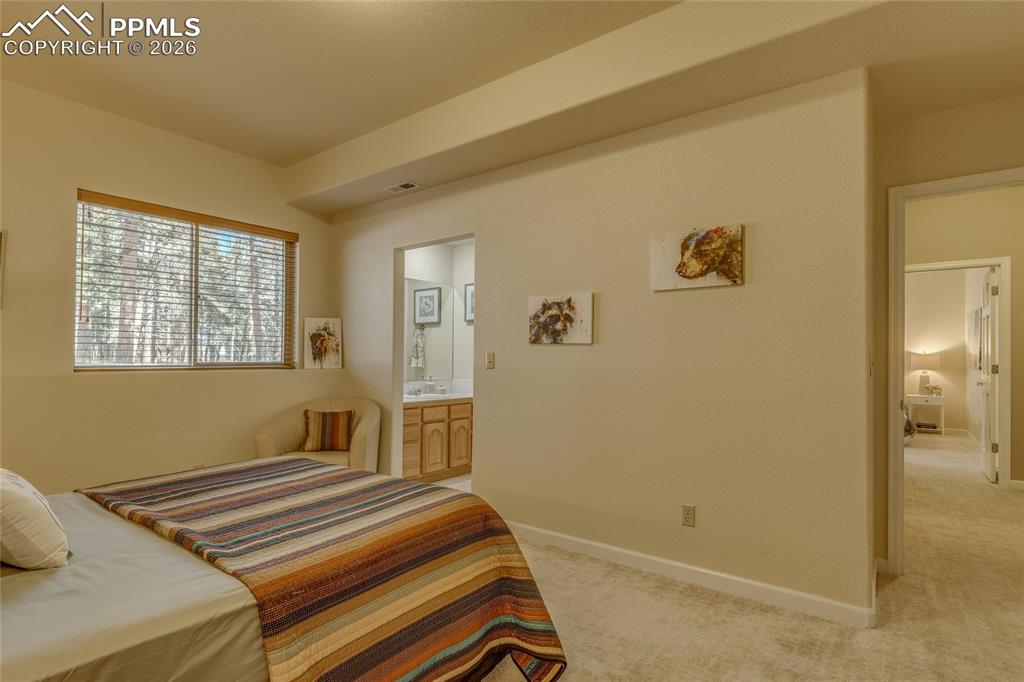 Bedroom has its own private vanity and sink area