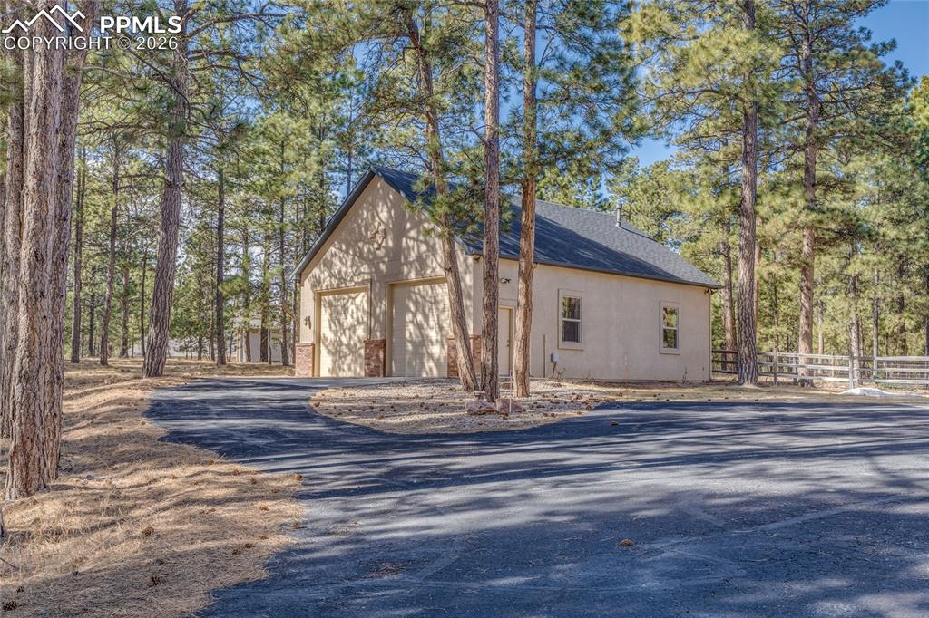 Heated 40 x 60 detached garage with two 10-foot doors.
