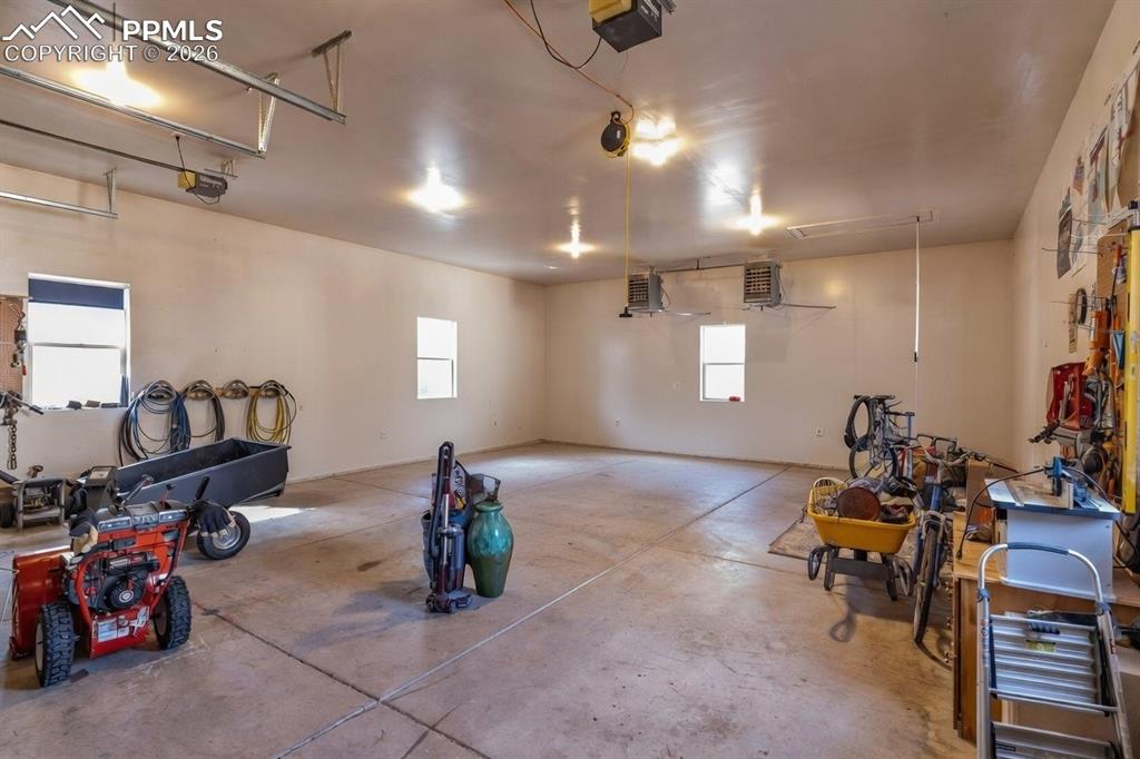 Inside the detached structure, two heaters and workspace to the right.