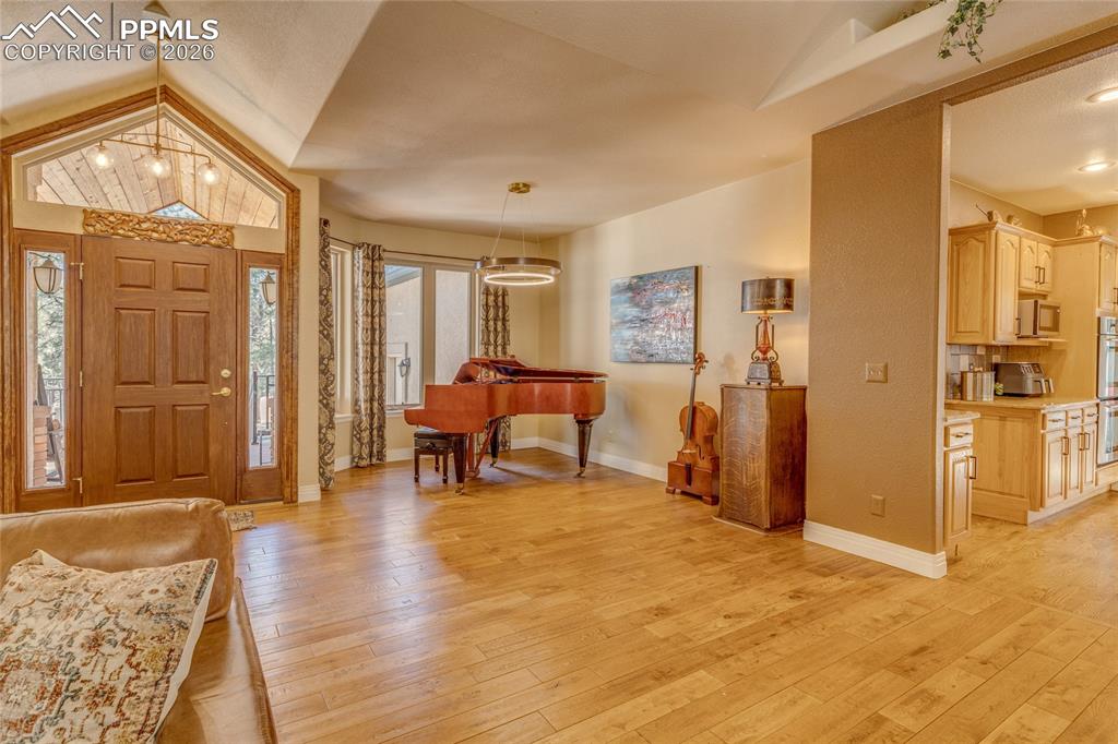 From the living room you can see the entry and music area and the beautiful 5" wood plank flooring.
