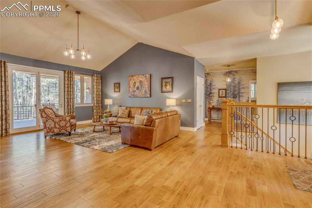 Very large open Living Room with lots of windows and door to enjoy the back deck.