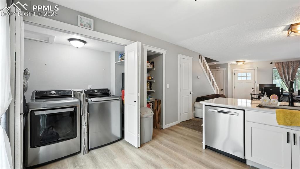 Convenient laundry closet with electrical hook up.