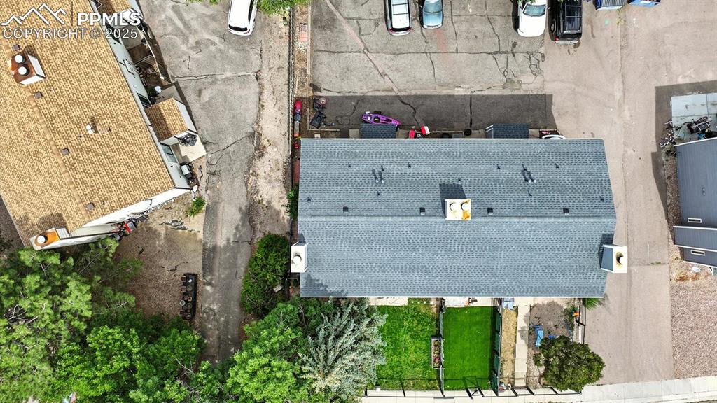 Aerial view of the front yard and backyard parking area.