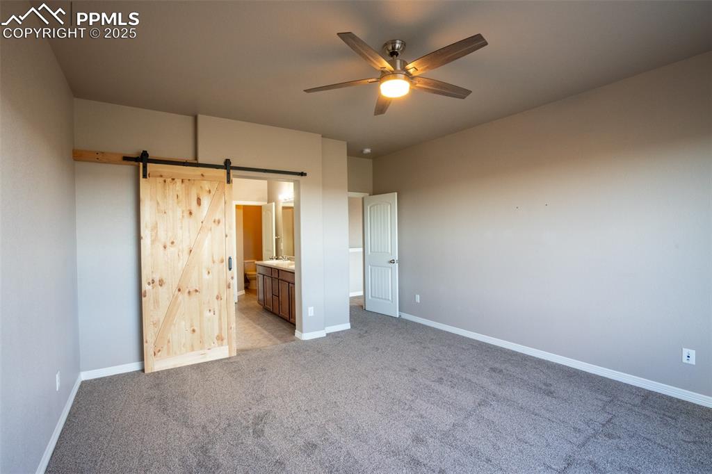 Primary bedroom with adjoining 5 piece bath and walk in closet (main floor)