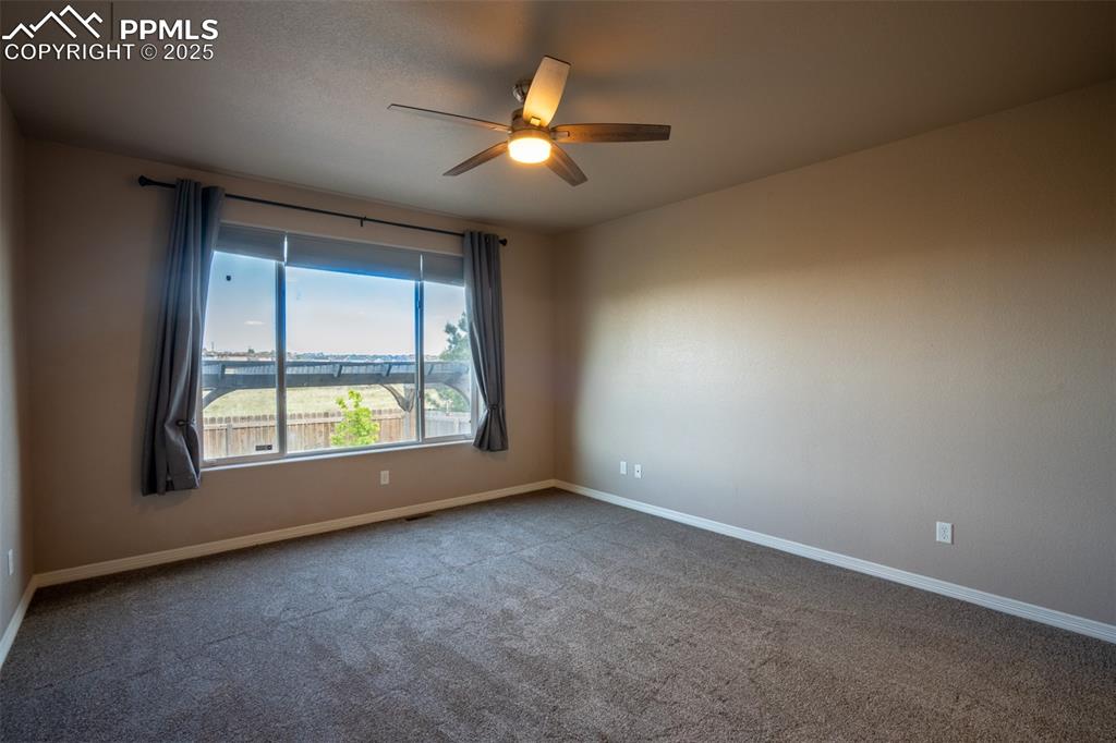 Primary bedroom with adjoining 5 piece bath and walk in closet (main floor)