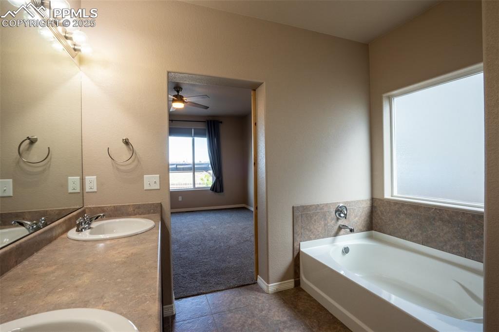 Primary 5 piece bathroom attached with walk in closet (main floor)