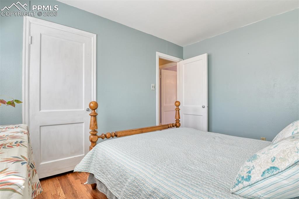 Bedroom with wood finished floors
