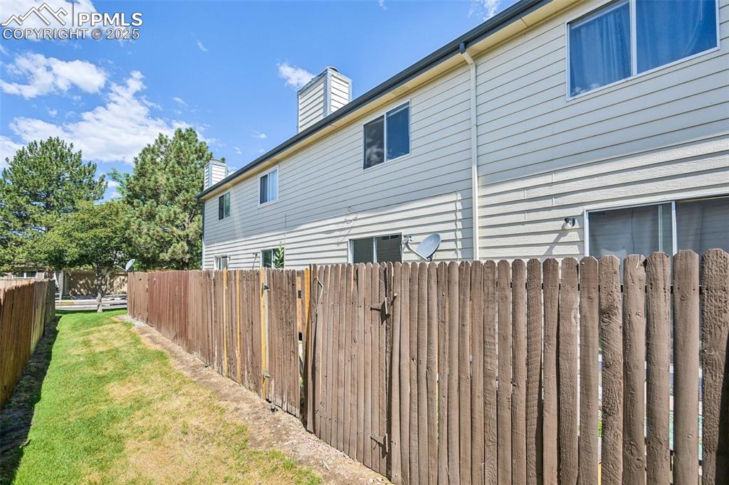 View of property exterior featuring a chimney