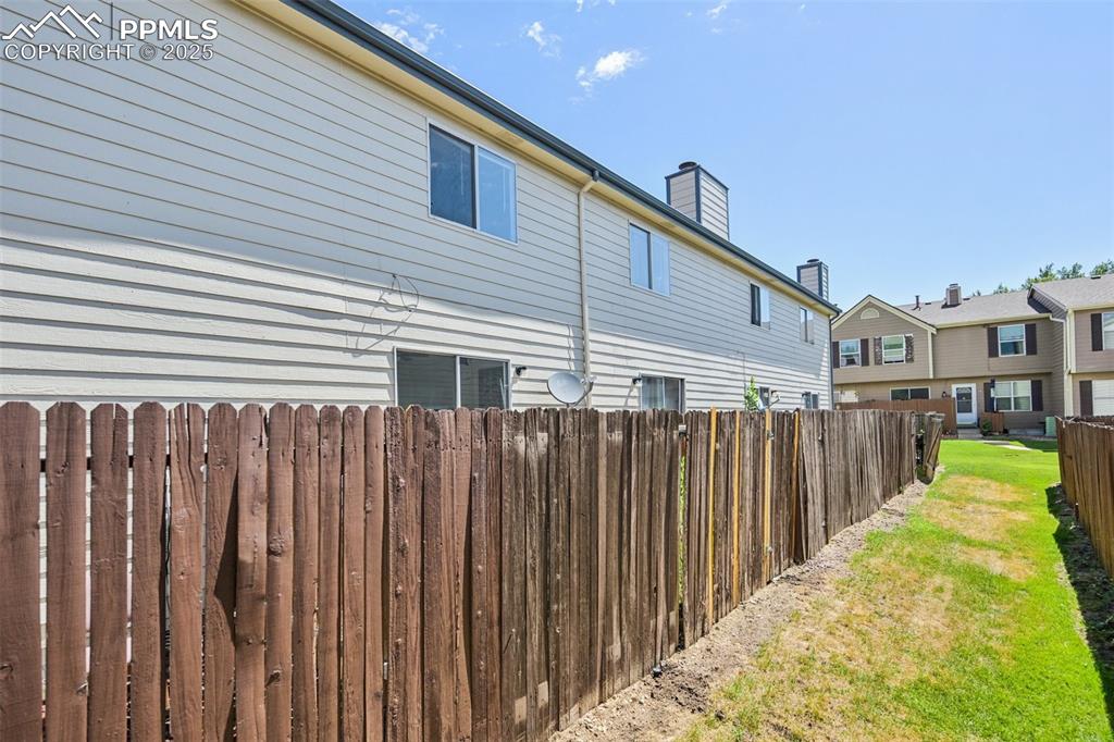 View of property exterior with a chimney