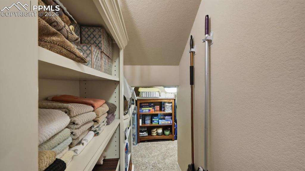 Spacious storage closet near the stairwell.