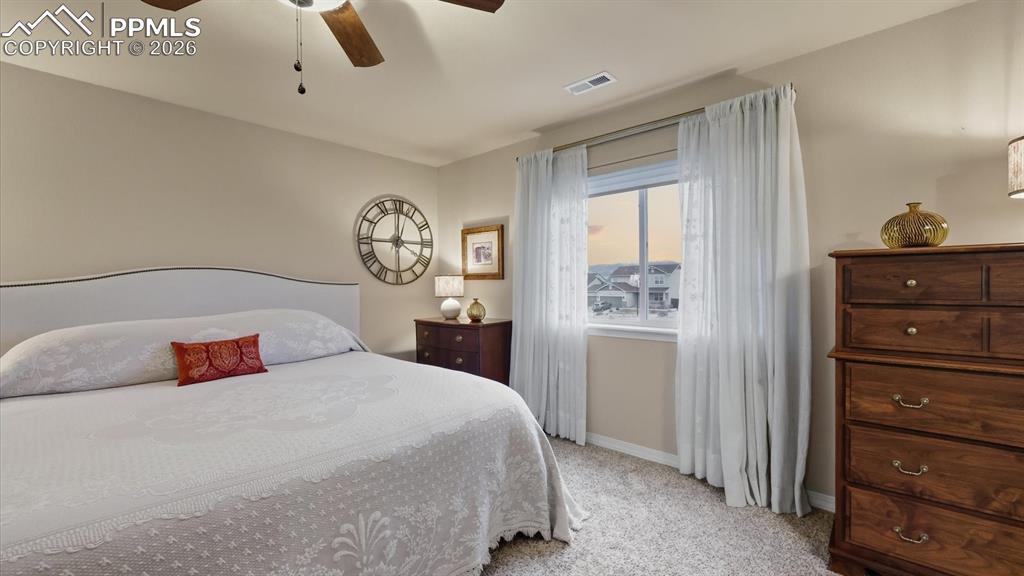 The upper level Primary Bedroom offers beautiful mountain views from the window.