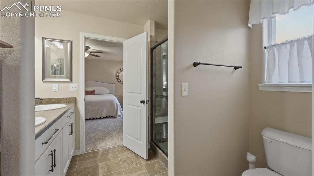 View into the Primary Bedroom from the Primary Bathroom.